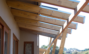Bolted timber rafters with custom flashings